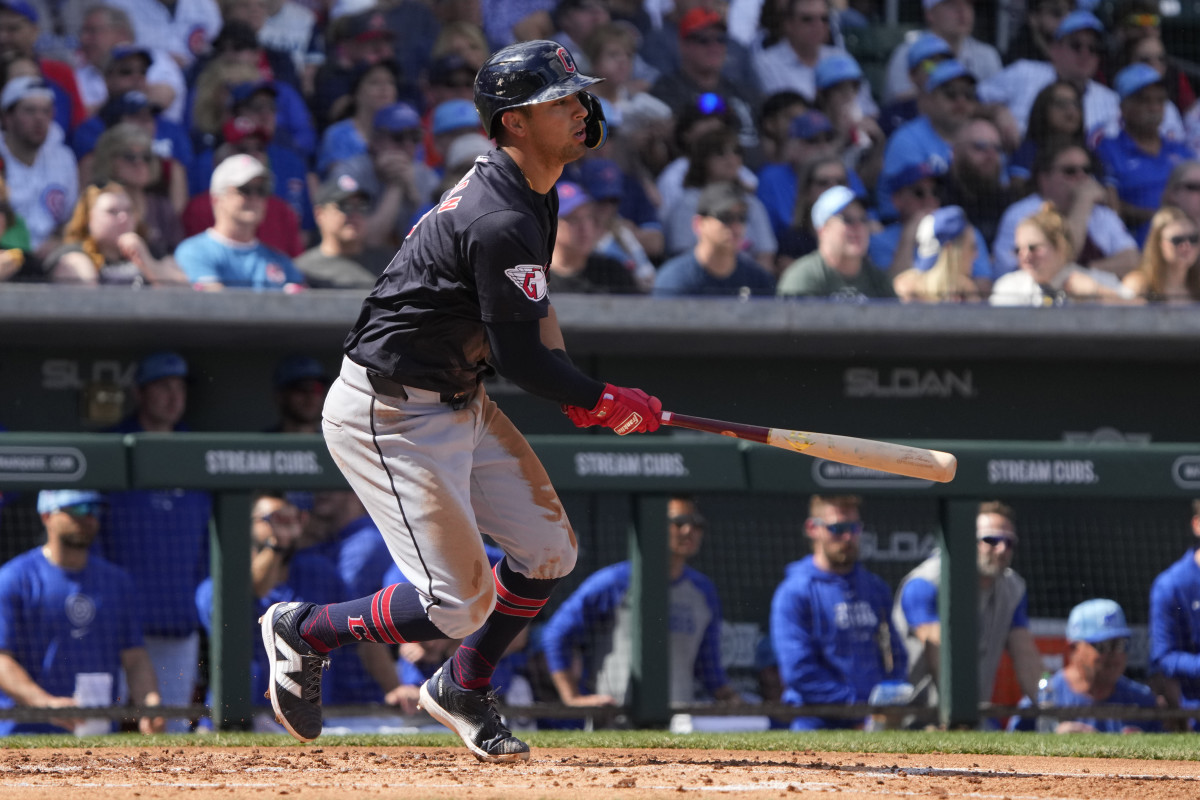 Mar 3, 2024; Mesa, Arizona, USA; Cleveland Guardians third baseman Tyler Freeman (2) hits an RBI single against the Chicago Cubs in the second inning at Sloan Park.